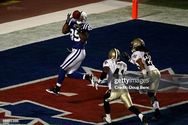 Pierre Garcon of the Indianapolis Colts catches a touchdown pass in the first quarter against the New Orleans Saints during Super Bowl XLIV on...