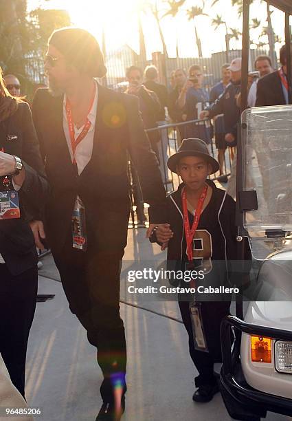 Brad Pitt and Maddox Jolie-Pitt are seen at Super Bowl XLIV at Sun Life Stadium on February 7, 2010 in Miami Gardens, Florida.