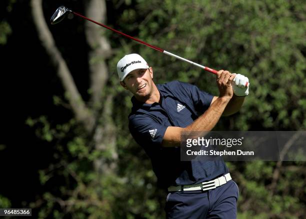 Dustin Johnson watches his tee shot on the 12th hole during the final round of the Northern Trust Open at Riviera Country Club on February 7, 2010 in...