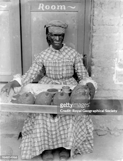 Woman selling Jack Fruit, This woman sells breadfruit, fruit de pain, which Captain Bligh first attempted to bring to the Caribbean from Polynesia on...