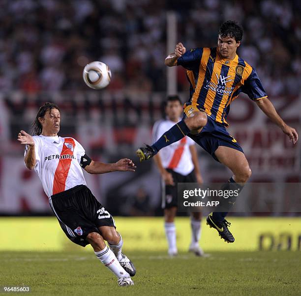 River Plate's midfielder Matias Almeyda vies for the ball with forward Emilio Zelaya of Rosario Central during their Argentina first division...