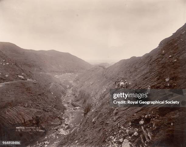 American scientists stand at a height of 2000 feet below Soufriere - Saint Vincent, American scientists stand at a height of 2, 000 feet below...