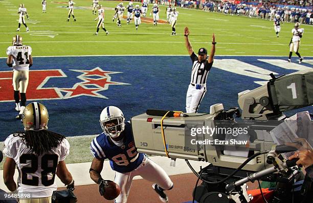 Pierre Garcon of the Indianapolis Colts runs into a TV camera making a catch for a touchdown in the first quarter against the New Orleans Saints...