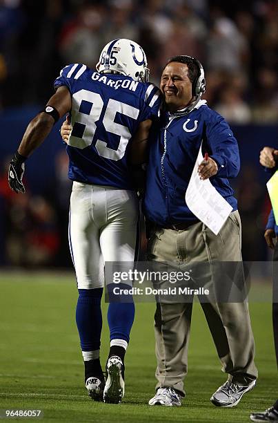 Pierre Garcon of the Indianapolis Colts celebrates on the sidelines with a coach against the New Orleans Saints during Super Bowl XLIV on February 7,...