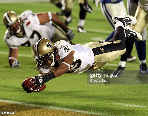 Pierre Thomas of the New Orleans Saints leaps into the end zone to score a touchdown against of the Indianapolis Colts in the third quarter during...