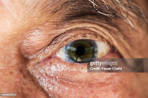 old man eye - black eye close up stock pictures, royalty-free photos & images