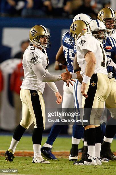 Garrett Hartley of the New Orleans Saints celebrates with Mark Brunell after kicking a field goal against the Indianapolis Colts during Super Bowl...