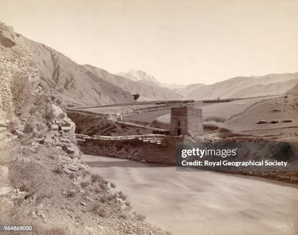 Chitral bridge and Tirich Mir, North West Frontier, This image was taken during the 'Gilgit Mission' of 1885-86 with Colonel W.S.A. Lockhart and...