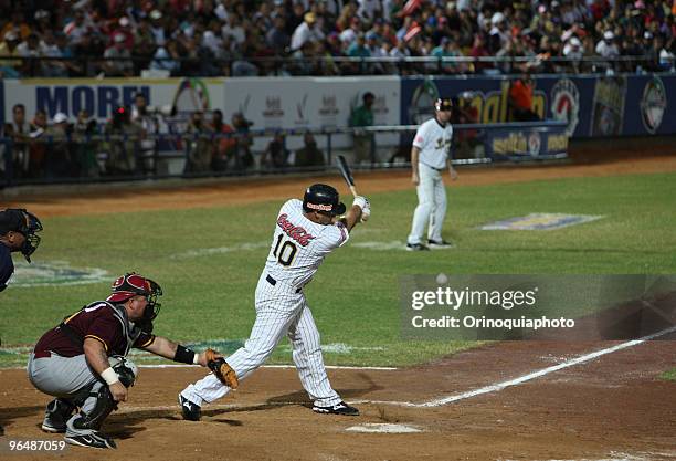 Oscar Salazar of Leones del Caracas swings to strike during Caribbean Baseball Series 2010 at the Guatamare Stadium on February 6, 2010 in Isla...