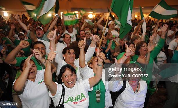 Supporters of Costa Rican presidential candidate for the ruling National Liberation Party, Laura Chinchilla, celebrate the preliminary results of the...