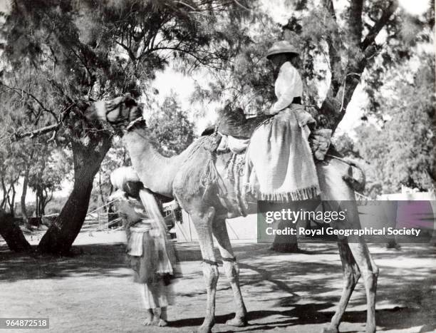 Miss Ward on the riding camel on which she toured the Thal - Punjab, Pakistan, 1902.