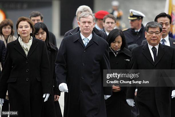 German President Horst Koehler and his wife Eva Luise Koehler visit the National Cemetery on February 8, 2010 in Seoul, South Korea. Germany and...