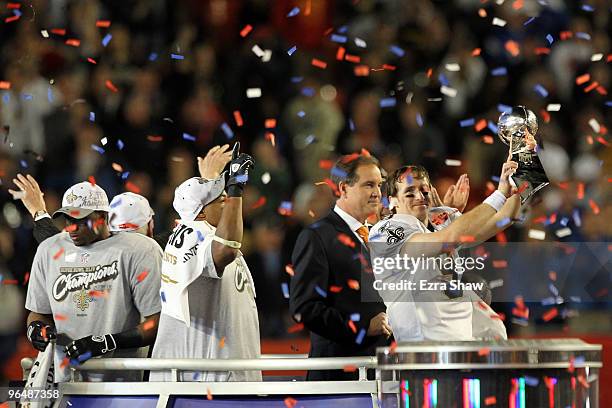 Drew Brees of the New Orleans Saints celebrates with the Vince Lombardi trophy at the end of Super Bowl XLIV on February 7, 2010 at Sun Life Stadium...