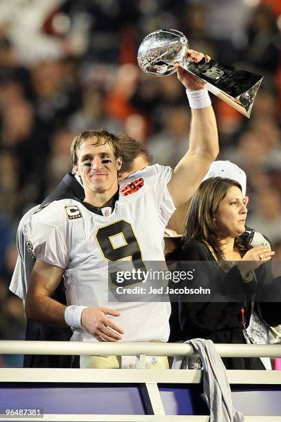 Drew Brees of the New Orleans Saints holds up the Vince Lombardi Trophy after defeating the Indianapolis Colts during Super Bowl XLIV on February 7,...