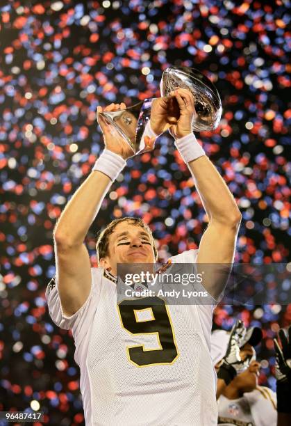 Drew Brees of the New Orleans Saints holds up the Vince Lombardi Trophy after defeating the Indianapolis Colts during Super Bowl XLIV on February 7,...