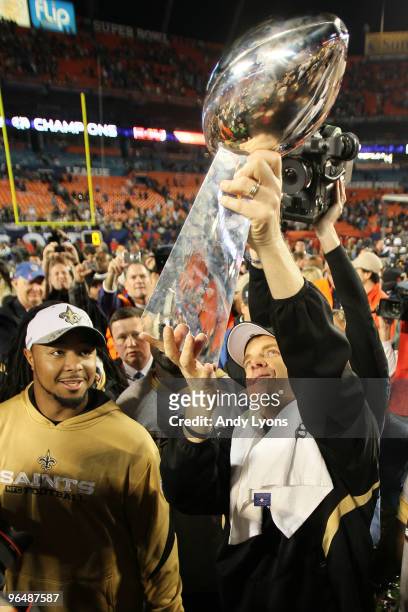 Head coach Sean Payton of the New Orleans Saints holds up the Vince Lombardi Trophy after defeating the Indianapolis Colts during Super Bowl XLIV on...