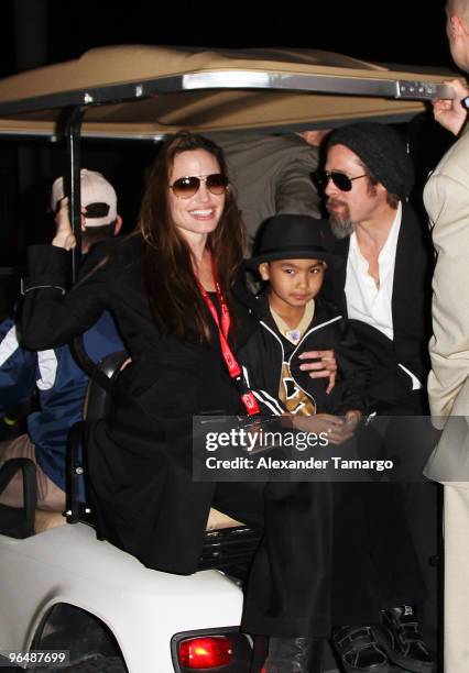 Actress Angelina Jolie, Maddox Jolie-Pitt and actor Brad Pitt leave Super Bowl XLIV at the Sun Life Stadium on February 7, 2010 in Miami Gardens,...