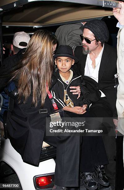 Actress Angelina Jolie, Maddox Jolie-Pitt and actor Brad Pitt leave Super Bowl XLIV at the Sun Life Stadium on February 7, 2010 in Miami Gardens,...