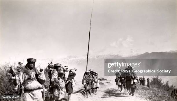 Bhutanese guards of honour with dancers and trumpeters, Bhutan, 1931.