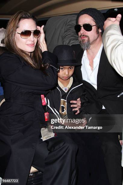 Actress Angelina Jolie, Maddox Jolie-Pitt and actor Brad Pitt leave Super Bowl XLIV at the Sun Life Stadium on February 7, 2010 in Miami Gardens,...