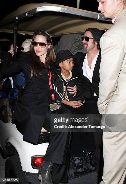 Actress Angelina Jolie, Maddox Jolie-Pitt and actor Brad Pitt leave Super Bowl XLIV at the Sun Life Stadium on February 7, 2010 in Miami Gardens,...