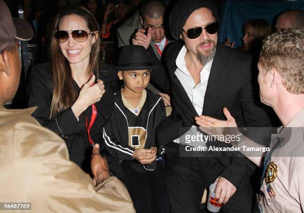 Actress Angelina Jolie, Maddox Jolie-Pitt and actor Brad Pitt leave Super Bowl XLIV at the Sun Life Stadium on February 7, 2010 in Miami Gardens,...