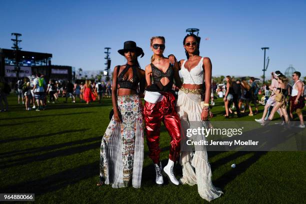 Jasmine Tookes, Romeo Strijd and Lais Ribeiro wearing a Victoria Secret BH and Romee wearing a YSL pants during day 1 of the 2018 Coachella Valley...