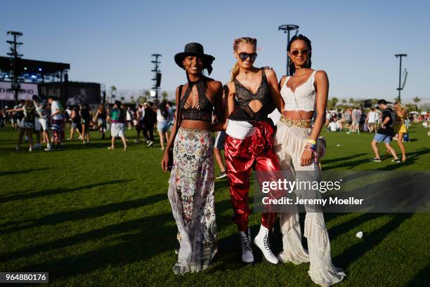 Jasmine Tookes, Romeo Strijd and Lais Ribeiro wearing a Victoria Secret BH and Romee wearing a YSL pants during day 1 of the 2018 Coachella Valley...
