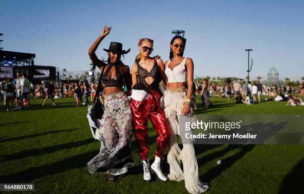 Jasmine Tookes, Romeo Strijd and Lais Ribeiro wearing a Victoria Secret BH and Romee wearing a YSL pants during day 1 of the 2018 Coachella Valley...