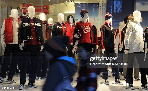 Shoppers walk by a Canadian Winter Olympic promotion at the Hudson's Bay department store in downtown Vancouver on February 7, 2010. Winter Olympics...