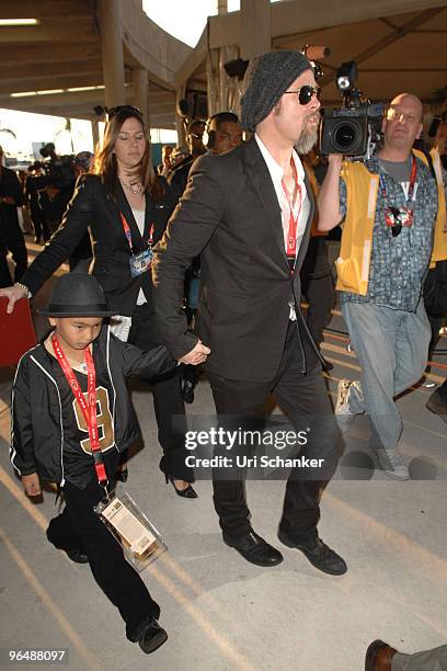 Brad Pitt and his son Maddox Jolie-Pitt arrive at Super Bowl XLIV at Sun Life Stadium on February 7, 2010 in Miami Gardens, Florida.