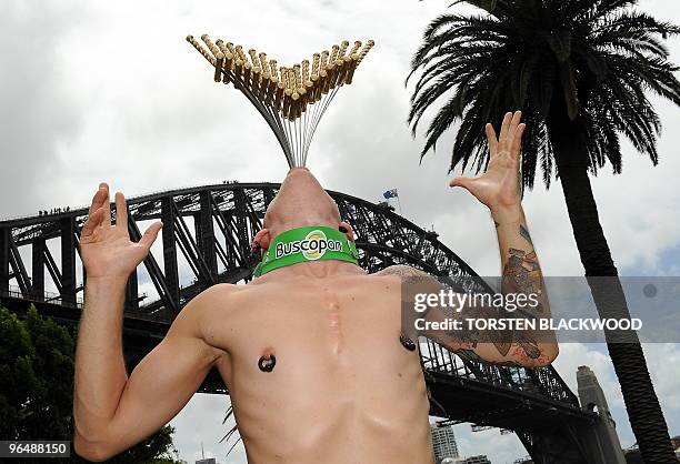 Internationally renowned street performer Chayne Hultgren , re-enacts his 18-sword swallowing attempt for a Guinness World Record in front of the...