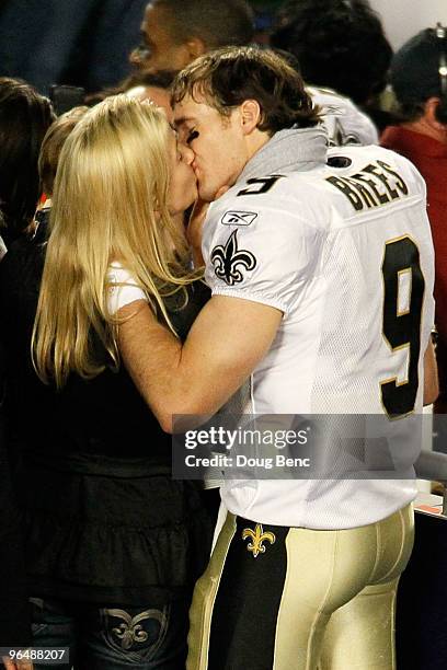 Drew Brees of the New Orleans Saints kisses his wife Brittany Brees after defeating the Indianapolis Colts during Super Bowl XLIV on February 7, 2010...