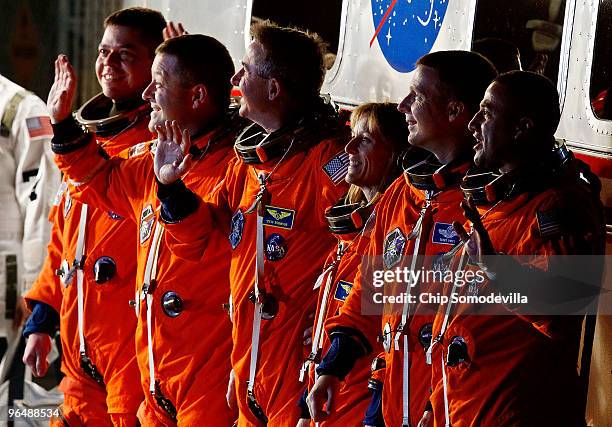 Space Shuttle Endeavour astronauts mission specialists Robert Behnken, Nicholas Patrick, Stephen Robinson, and Kathryn Hire, with pilot Terry Virts...