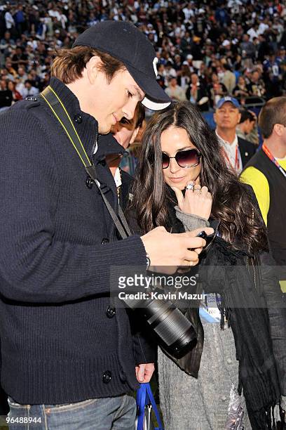 Actor Ashton Kutcher and actress Demi Moore attend Super Bowl XLIV at Sun Life Stadium on February 7, 2010 in Miami Gardens, Florida.