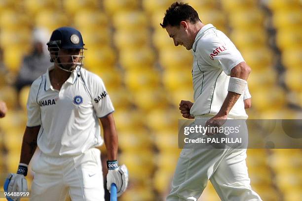 South African cricketer Dale Steyn celebrates the wicket of Indian cricketer Murali Vijay on the third day of the first cricket Test match between...