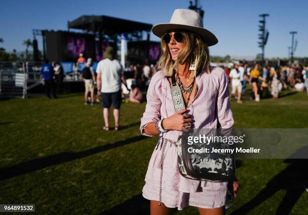 Coachella guest wearing a Furla bag during day 2 of the 2018 Coachella Valley Music & Arts Festival Weekend 1 on April 14, 2018 in Indio, California.