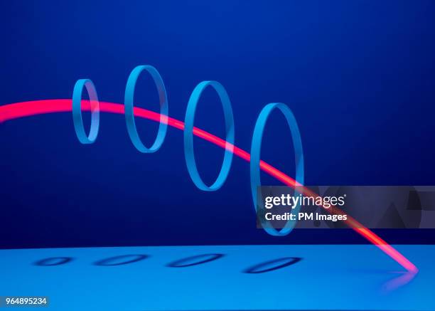 red light streaking through 4 hoops - scoring system stock pictures, royalty-free photos & images