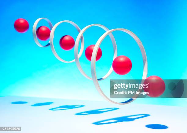 red balls going through hoops - scoring system stock pictures, royalty-free photos & images