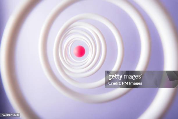 red ball in center of hoops - bullseye target stock pictures, royalty-free photos & images