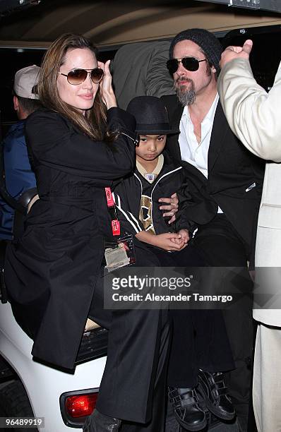 Angelina Jolie, Maddox Jolie-Pitt and Brad Pitt are seen leaving Super Bowl XLIV at Sun Life Stadium on February 7, 2010 in Miami Gardens, Florida.