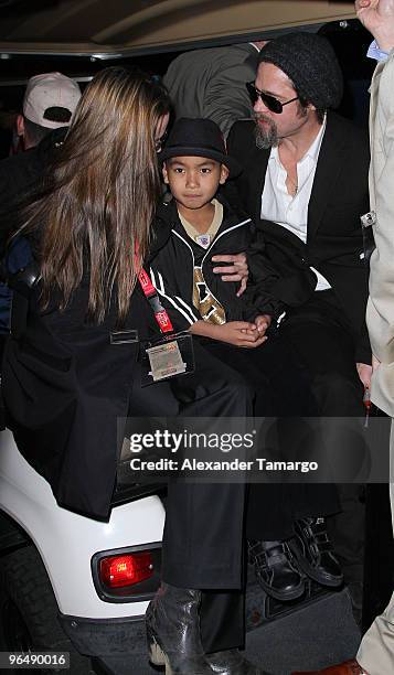 Angelina Jolie, Maddox Jolie-Pitt and Brad Pitt are seen leaving Super Bowl XLIV at Sun Life Stadium on February 7, 2010 in Miami Gardens, Florida.