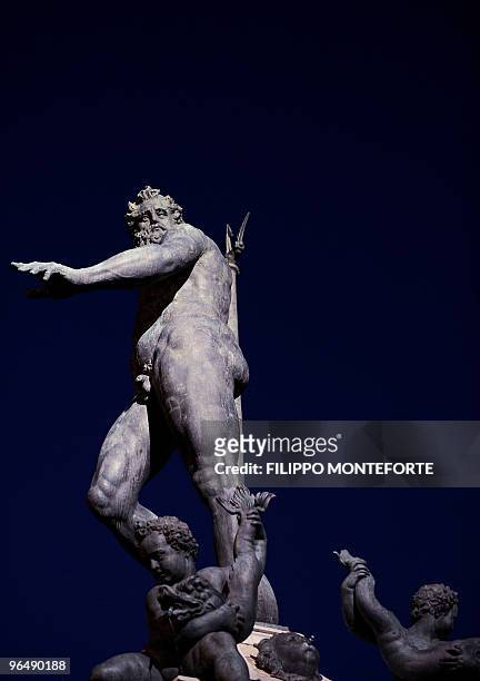The statue of Poseidon is seen central Bologna's Piazza Grande on February 7, 2010. AFP PHOTO / Filippo MONTEFORTE
