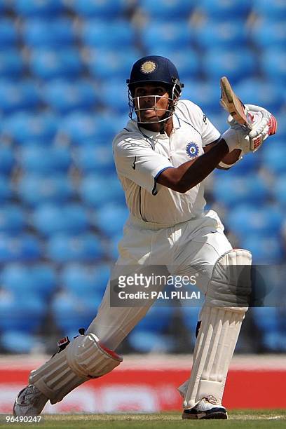 Indian cricketer Subramaniam Badrinath plays a shot on the third day of the first cricket test match between India and South Africa in Nagpur on...