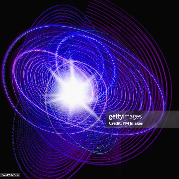 burst of white light in swirling multi colored lights - quadratisch-komposition stock-fotos und bilder