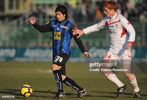 Jaime Valdes of Atalanta BC competes for the ball with Alessandro Gazzi of AS Bari during the Serie A match between Atalanta BC and AS Bari at Stadio...