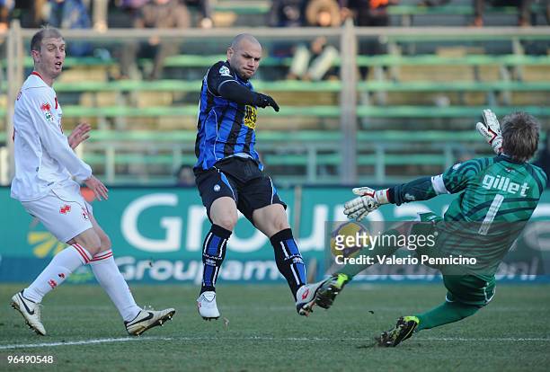 Jean Francois Gillet of AS Bari blocks the shot Simone Tiribocchi of Atalanta BC during the Serie A match between Atalanta and Bari at Stadio Atleti...