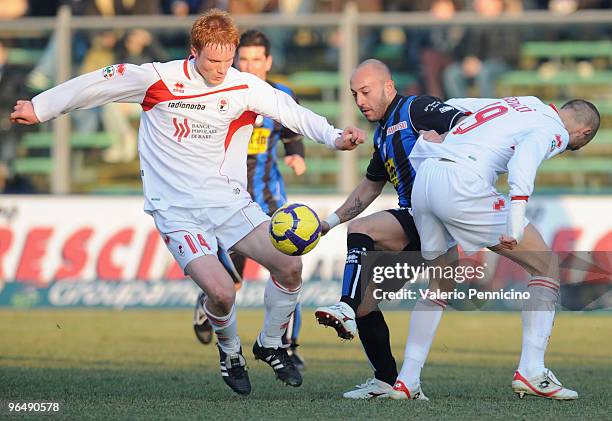 Ernesto Javier Chevanton of Atalanta BC competes for the ball with Alessandro Gazzi and Leonardo Bonucci of AS Bari during the Serie A match between...