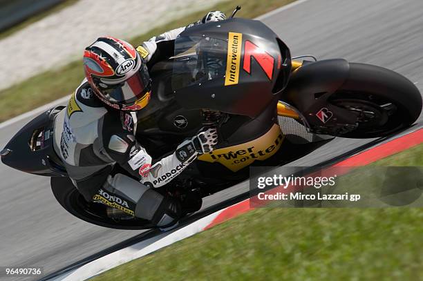 Hiroshi Aoyama of Japan and Interwetten Honda MotoGP Team rounds the bend during the second day of the MotoGP test at Sepang International Circuit,...