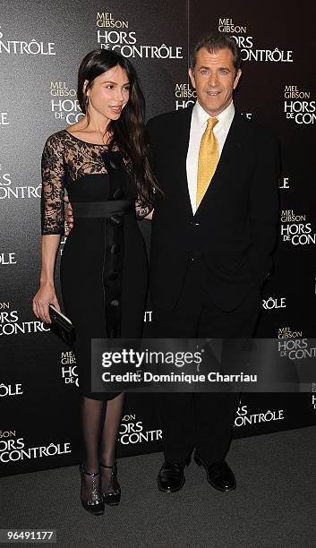 Actor Mel Gibson and Oksana Grigorieva attend the film premiere of "Edge Of Darkness" at Cinema UGC Normandie on February 4, 2010 in Paris, France.